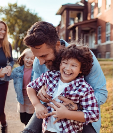 A young family walking and playing outside