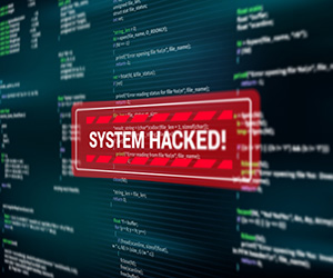 Computer screen displaying a "System Hacked!" message in red.