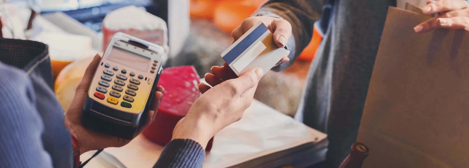 Close up of a person's hands holding a credit card