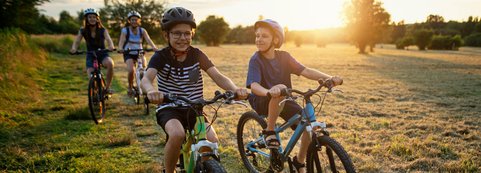 Four kids riding bikes