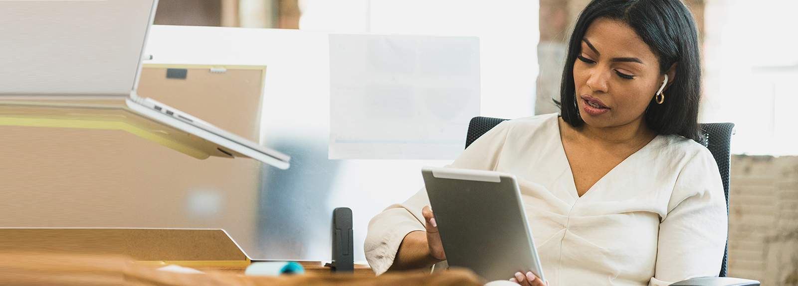 Business woman using her tablet device.